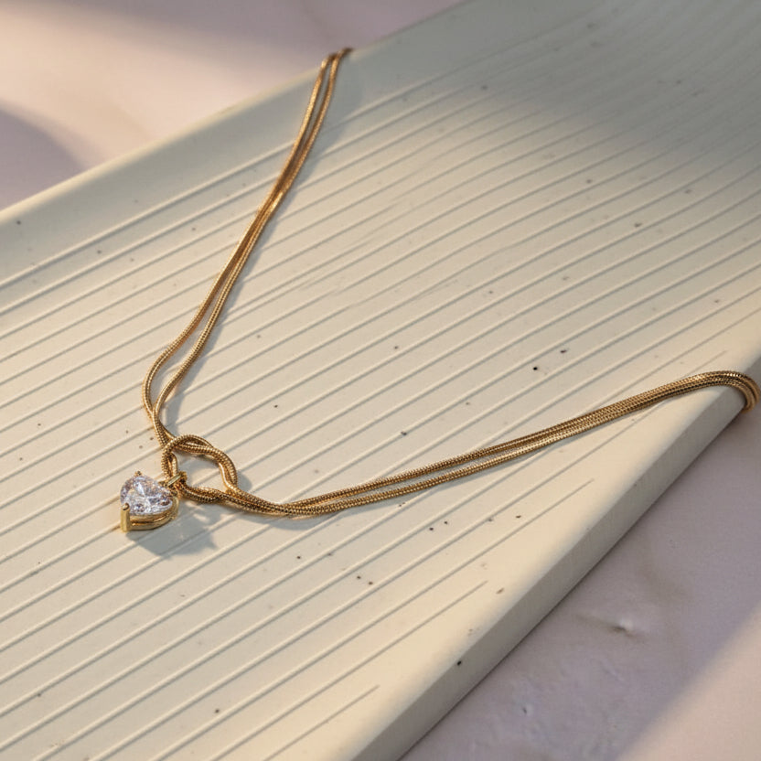 Gold Love Knot Necklace with Heart Crystal